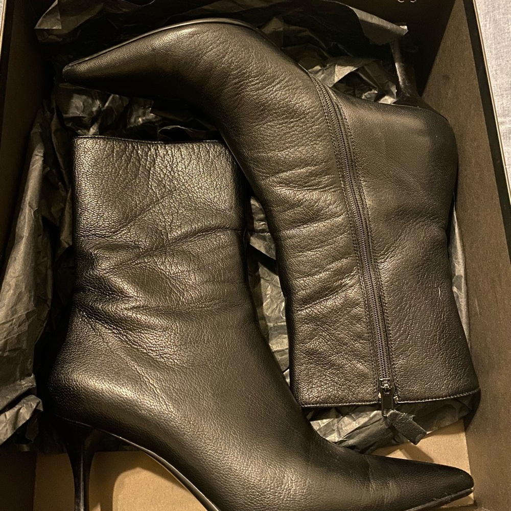 Gucci leather black boots.